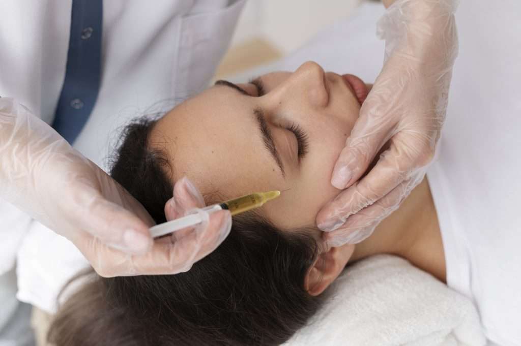young woman getting prp treatment high angle